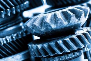 Gears, grunge cogwheels, real engine elements close-up. Heavy industry photo