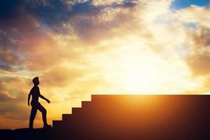 Silhouette of a man standing in front of stairs. photo