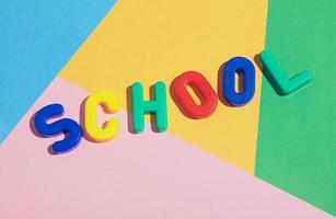 SCHOOL writing on a colorful pastel background. photo