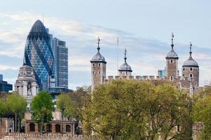 London, England, 2022 - The Tower of London and the 30 St Mary Axe skyscraper. England, UK. photo