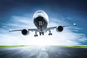 Passenger airplane taking off on runway photo