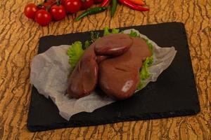 Raw pork kidneys photo