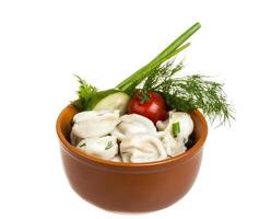 Bowl with traditional russian dish - pelmeni photo