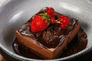 Sweet chocolate cake served strawberry photo