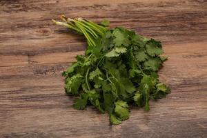 Green coriander or cilanto leaves heap photo