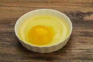 Raw Chicken egg in the bowl photo