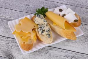 Bruschetta with various cheeses photo