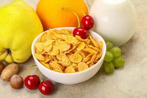 Breakfast with corn flakes and milk photo