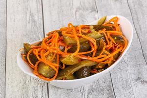Pickled cucumbers with carrot and herbs