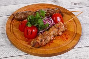 Chicken and beef skewers photo