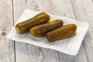 Pickled homemade cucumbers photo