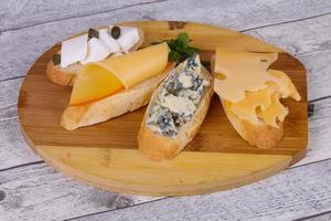 Bruschetta with various cheeses photo