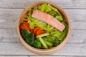 Steamed salmon with vegetables photo