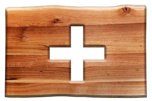 Cross cut in wooden board isolated on white photo