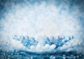 Cold winter glitter background with snowflake photo