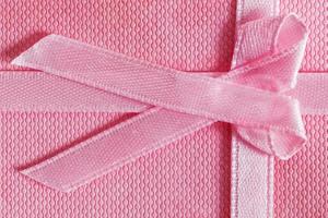 Pink gift box with tied ribbon photo