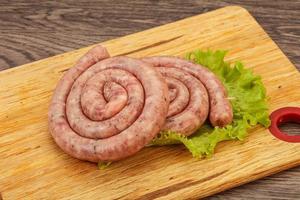 Raw sausage ring for grill photo