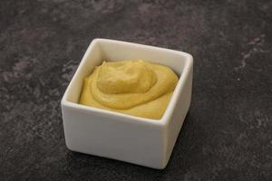 Dijon mustard sauce in the bowl photo