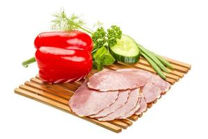 Ripe fresh ham with vegetables photo