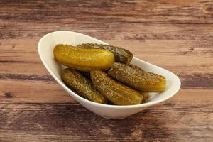 Pickled cucumbers in the plate photo