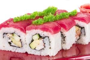 Maki Sushi - Roll made of Crab, avocado, cucumber inside. Fresh Tuna and tobico roe outside photo
