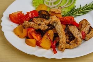 Fried pork with vegetables photo