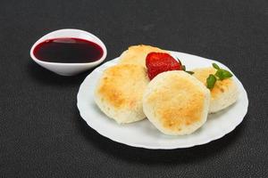 Curd pancakes with jam and stravberry photo