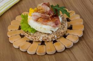 Crispy sandwich with egg and bacon photo