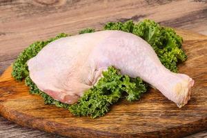 Raw chicken leg for cooking photo