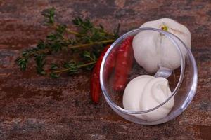 Mayonnaise sauce in the white bowl served thyme and garlic photo