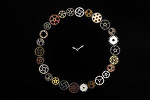 Simple clock made out of little cogwheels. photo