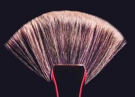 Conturing makeup brush on black background photo