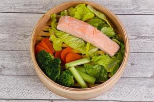 Steamed salmon with vegetables photo