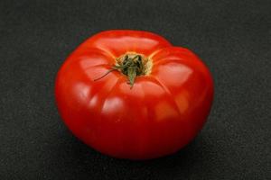 Ripe big juicy red tomato photo