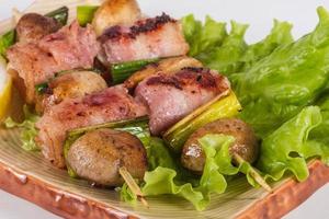 Bacon wrapped grilled Scallops with mushrooms and bacon photo