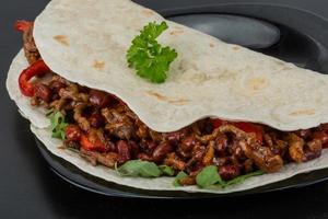 Burrito with minced meat and beans photo