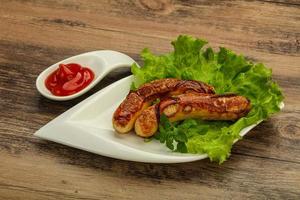 Roasted chicken white sausages with ketchup photo