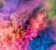 Holi powder bursting up, creating exploding texture. photo