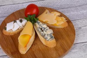 Bruschetta with various cheeses photo