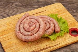 Raw sausage ring for grill photo