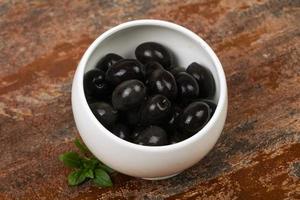 Black olives in the bowl photo