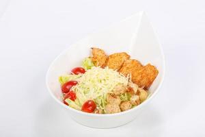 Caesar salad with chicken and parmesan photo