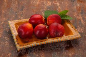 Sweet tasty ripe few nectarines photo