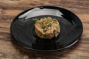 Raw beef tartar with capers photo