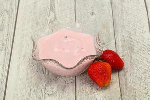 Yoghurt with strawberry in the bowl photo