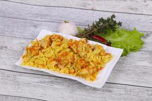 Traditional Pilaf with chicken and carrot photo