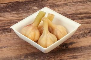 Marinated garlic in the bowl photo