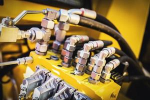 Black wires attached to a machine. Railway industry photo