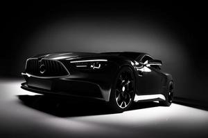 Modern black sports car in a spotlight on a black background. photo