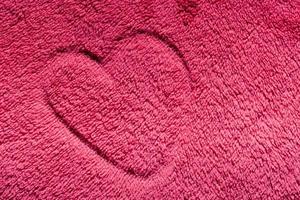 Heart on red furry cloth. Love, Valentine's Day background photo